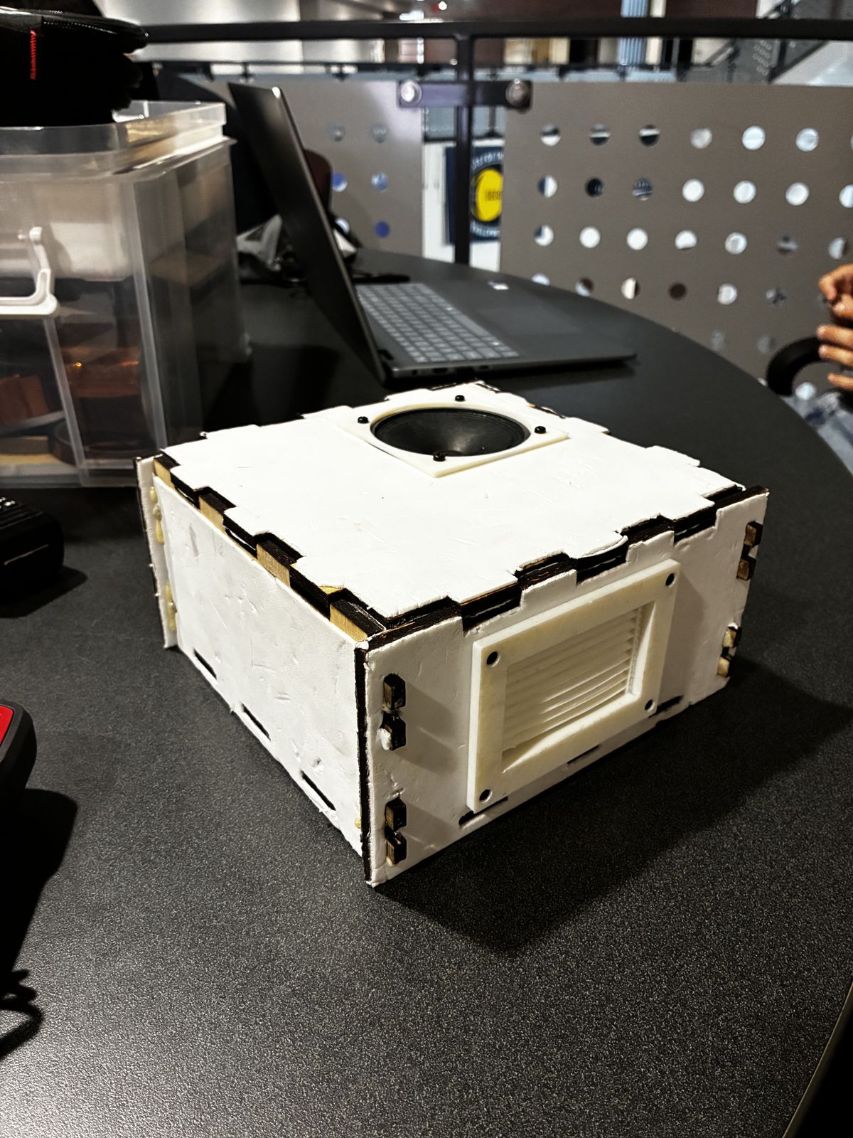 The built KAOS-2 wooden enclosure with a speaker and vent panel