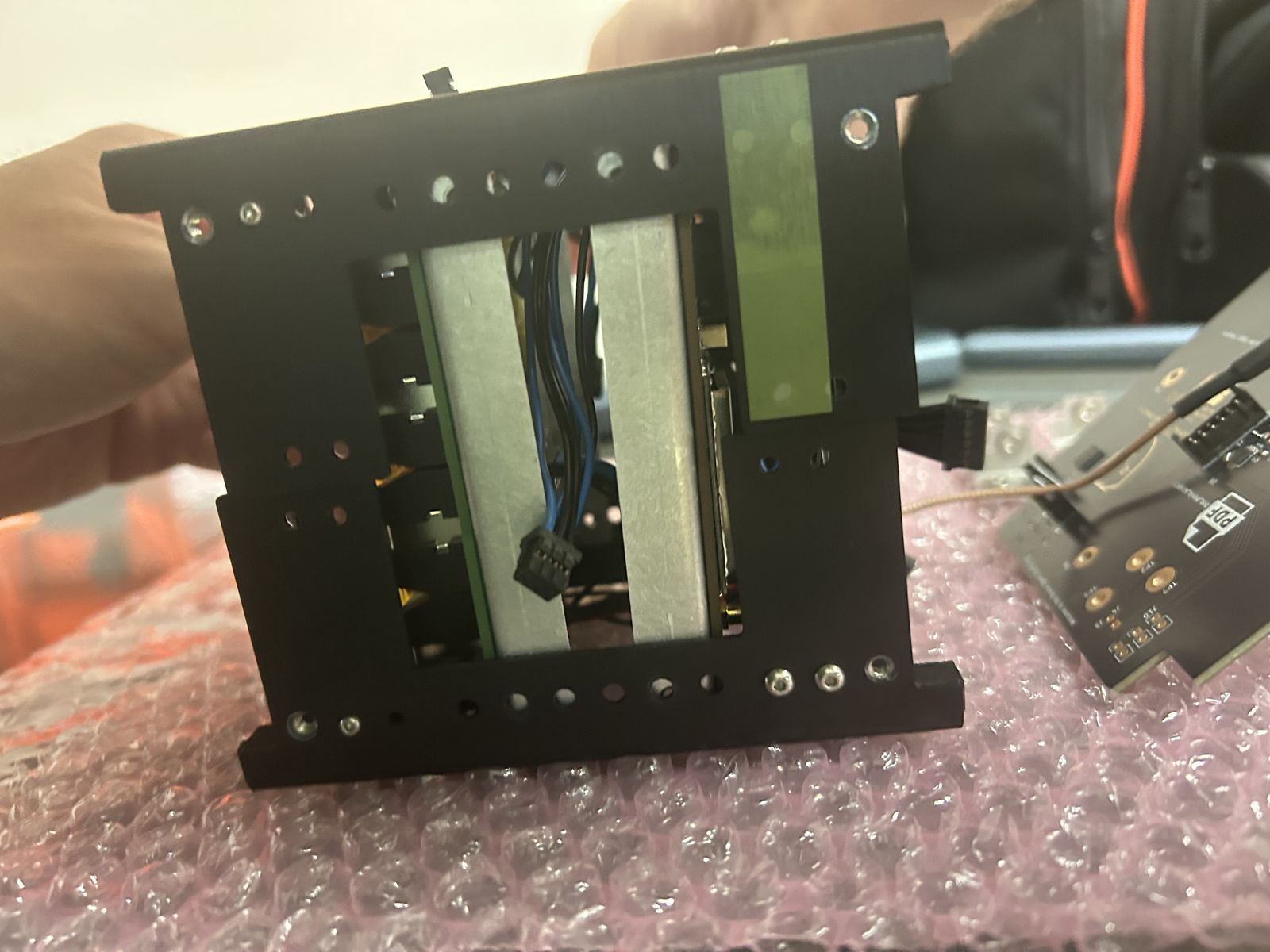 Opposite side of the frame showing brackets and wiring